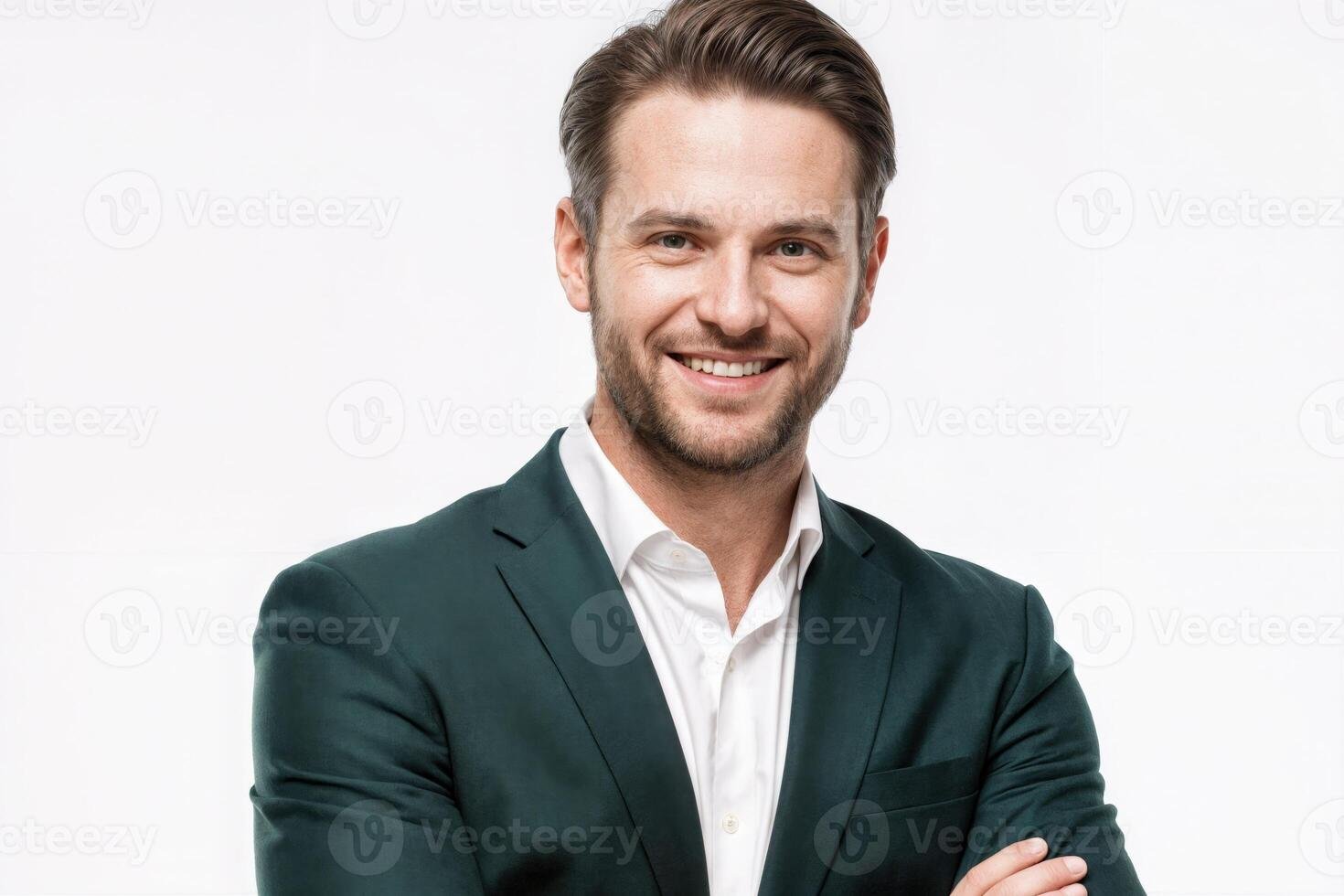 professional man in a business suit smiling confidently with folded arms against a plain background during a studio shoot photo